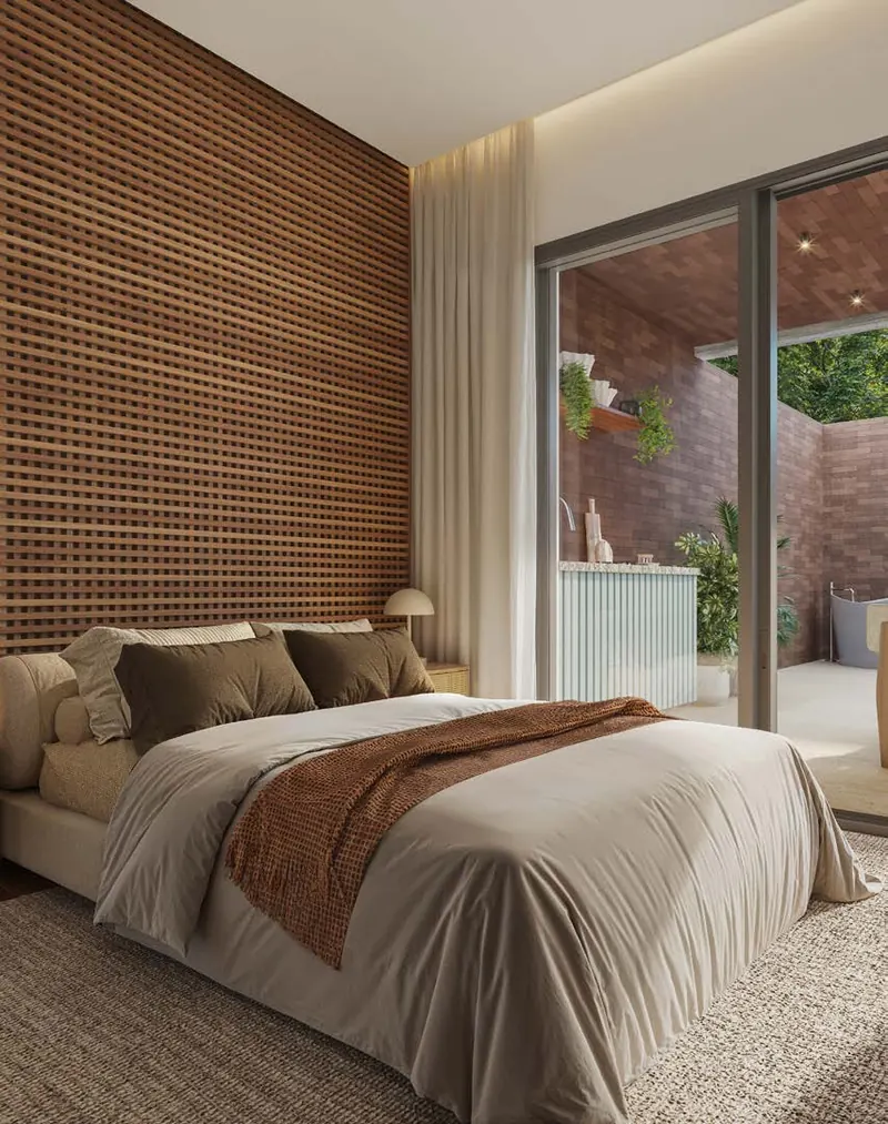 Quarto de studio do MO.dO Design Living Botafogo com cabeceira de madeira e janela ampla